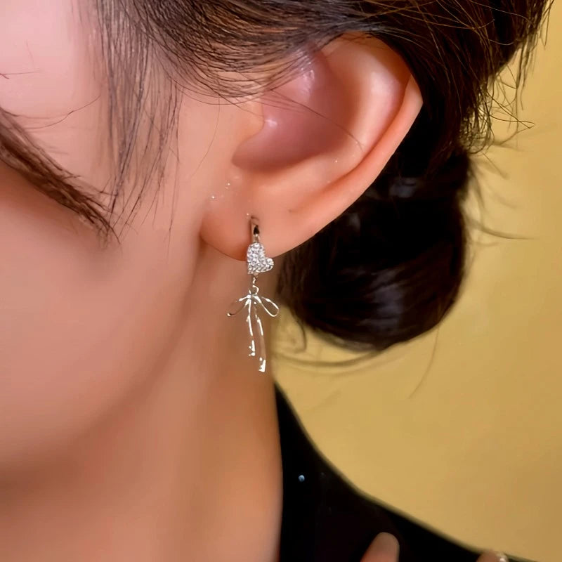 Close-up detail of the sparkling zircons and plating on the Heart Tassel Earrings