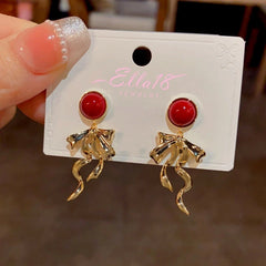 Close-up detail of the sparkling zircons and plating on the Red Tassel Earrings