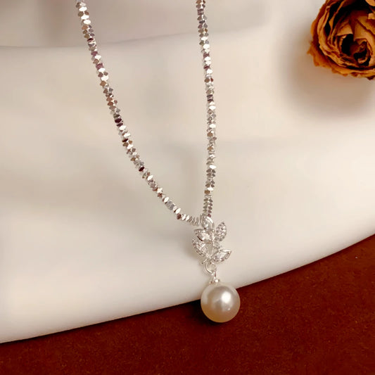14K Gold-Plated Broken Silver Zircon Leaf Pearl Necklace worn to showcase its length and pendant detail