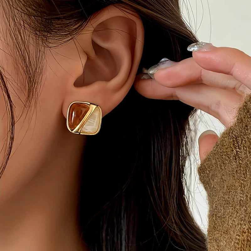 Angled view of the 14K Gold-Plated Brown And White Square Earrings