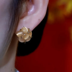 Close-up detail of the sparkling zircons and plating on the Cat's Eye Earrings