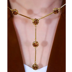 14K Gold-Plated Brown Crystal Tassel Necklace worn to showcase its length and pendant detail
