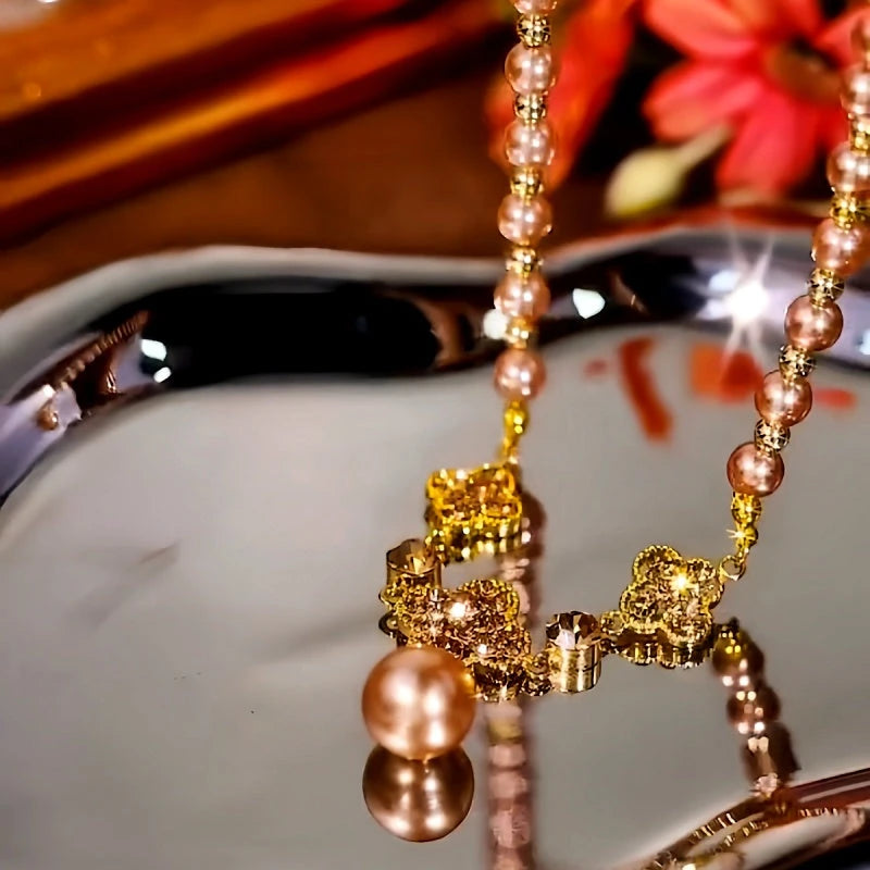 Close-up of the pendant and clasp on the Flower Bead Necklace