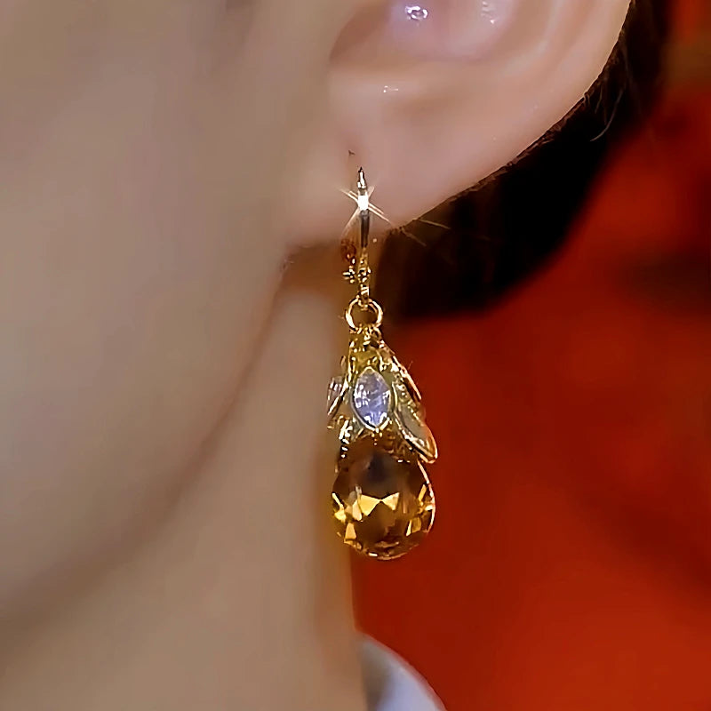 Close-up detail of the sparkling zircons and plating on the Leaf Drop Earrings