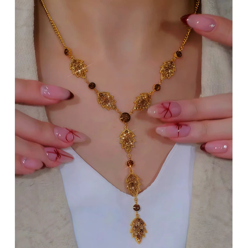 Close-up of the pendant and clasp on the Leaf Tassel Earrings