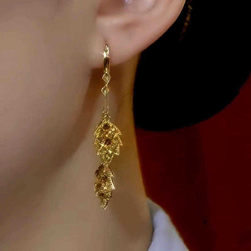 Close-up detail of the sparkling zircons and plating on the Leaf Tassel Earrings