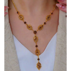 14K Gold-Plated Brown Diamond Leaf Tassel Earrings worn to showcase its length and pendant detail