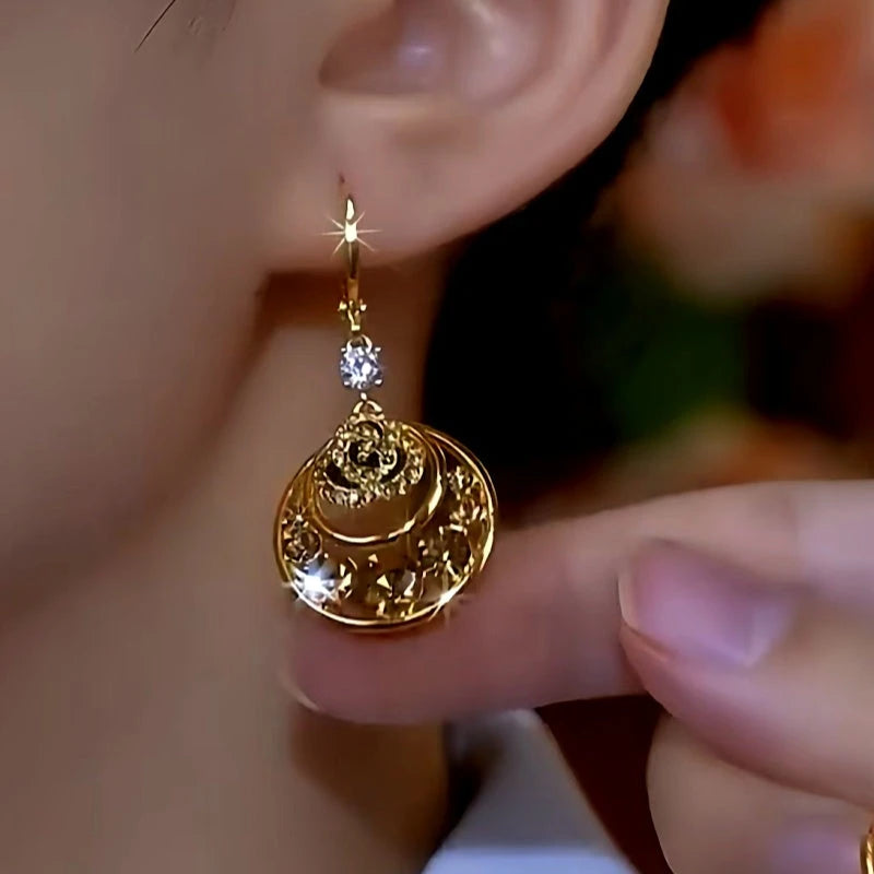 Close-up detail of the sparkling zircons and plating on the Mesh Hoop Earrings