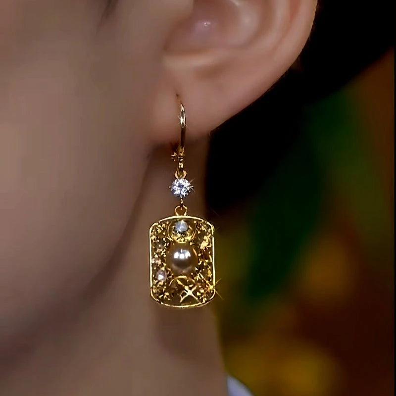 Perfect gold pearl earrings for adding glamour to any outfit