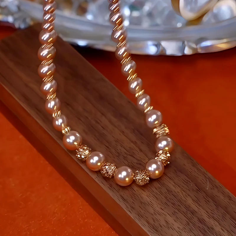Close-up of the pendant and clasp on the Pearl Necklace
