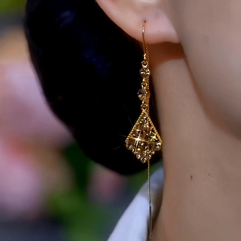 Close-up detail of the sparkling zircons and plating on the Threader Tassel Earrings