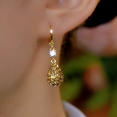 Close-up detail of the sparkling zircons and plating on the Brown Water Drop Earrings