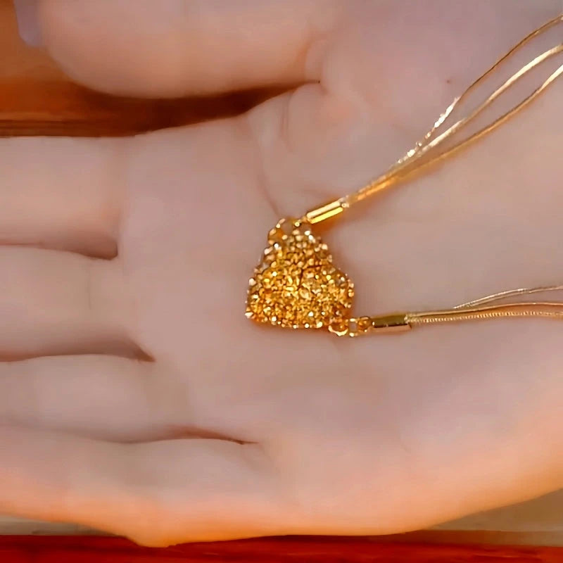 Close-up of the pendant and clasp on the Magnetic Heart Necklace