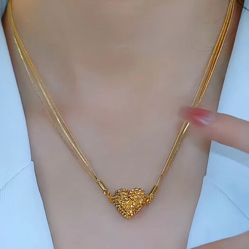 Detailed view of the 14K Gold-Plated Brown Magnetic Heart Necklaces chain and pendant