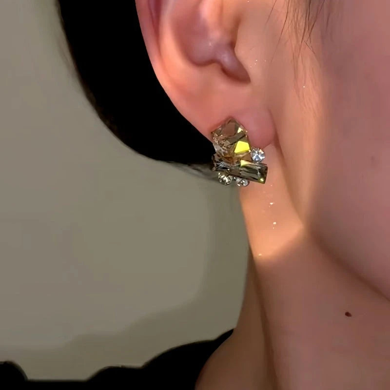 Model showcasing the dangle and style of the 14K Gold-Plated Brown Sugar Cube Diamond Stud Earrings