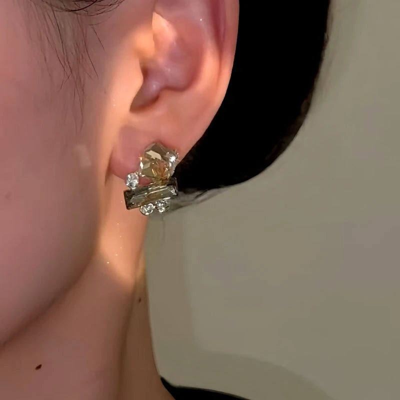 Close-up detail of the sparkling zircons and plating on the Cube Stud Earrings