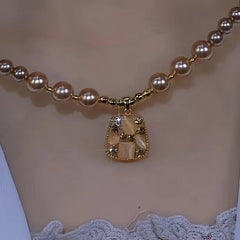 Detailed view of the 14K Gold-Plated Brown Zircon Bead Necklace chain and pendant