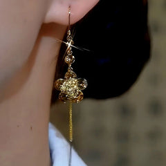 Close-up detail of the sparkling zircons and plating on the Flower Threader Earrings
