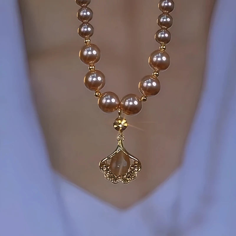 14K Gold-Plated Brown Zircon Ginkgo Diamond Leaf Pearl Necklace worn to showcase its length and pendant detail