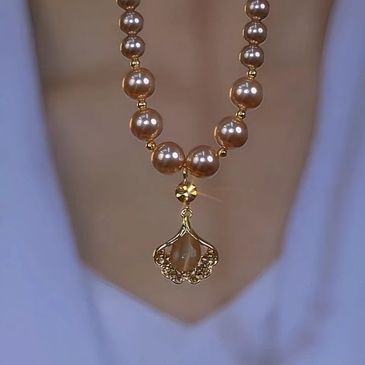 14K Gold-Plated Brown Zircon Ginkgo Diamond Leaf Pearl Necklace worn to showcase its length and pendant detail