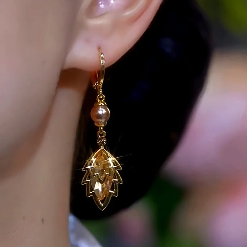 Close-up detail of the sparkling zircons and plating on the Pearl Leaf Earrings
