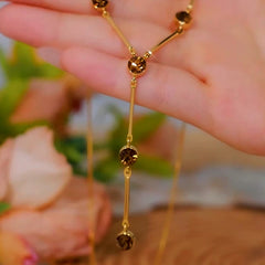 Close-up of the pendant and clasp on the Brown Zircon Necklace