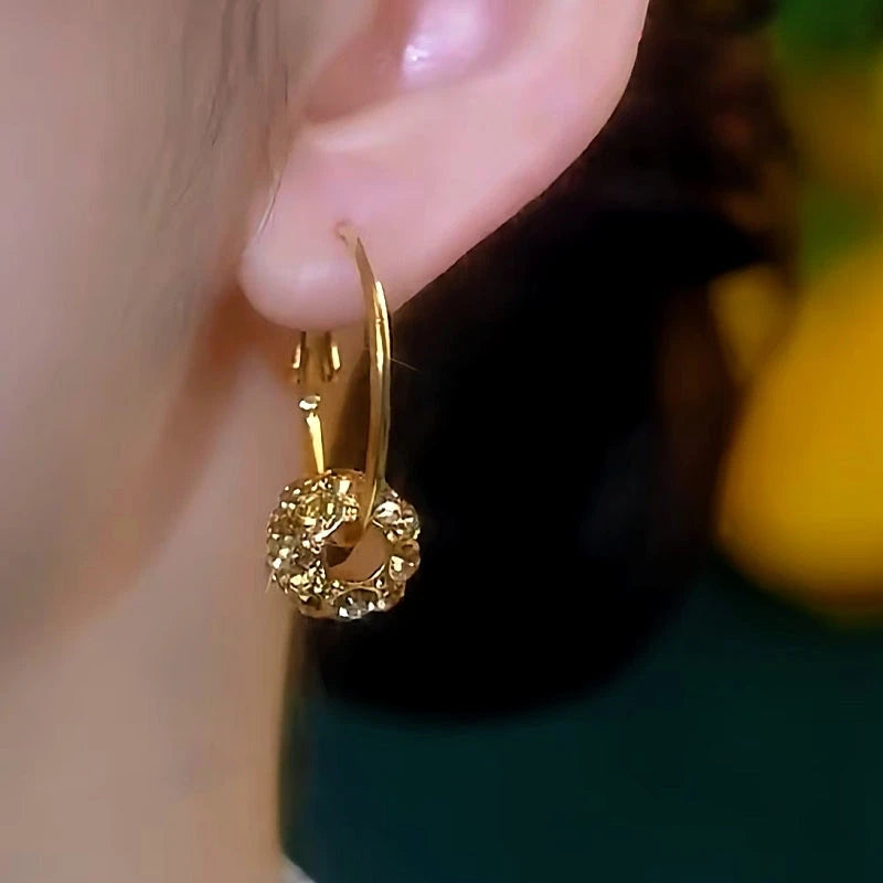 Close-up detail of the sparkling zircons and plating on the Zircon Hoop Earrings