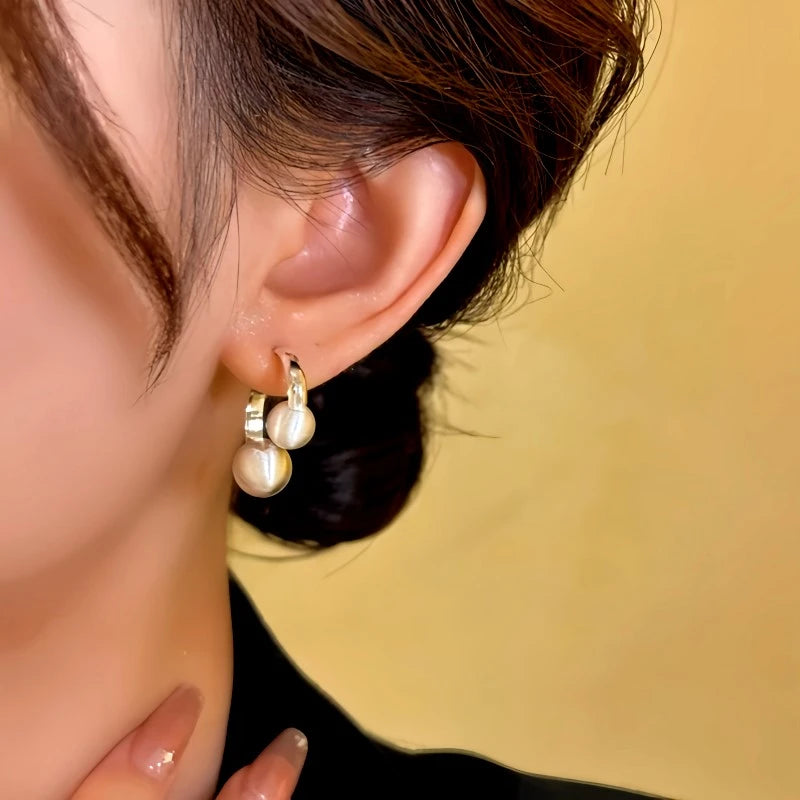 Close-up detail of the sparkling zircons and plating on the Brushed Bead Earrings
