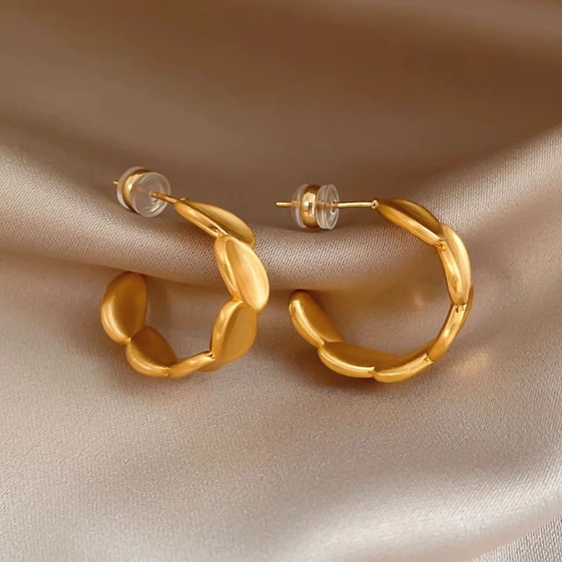 Angled view of the 14K Gold-Plated Brushed C-Shaped Earrings