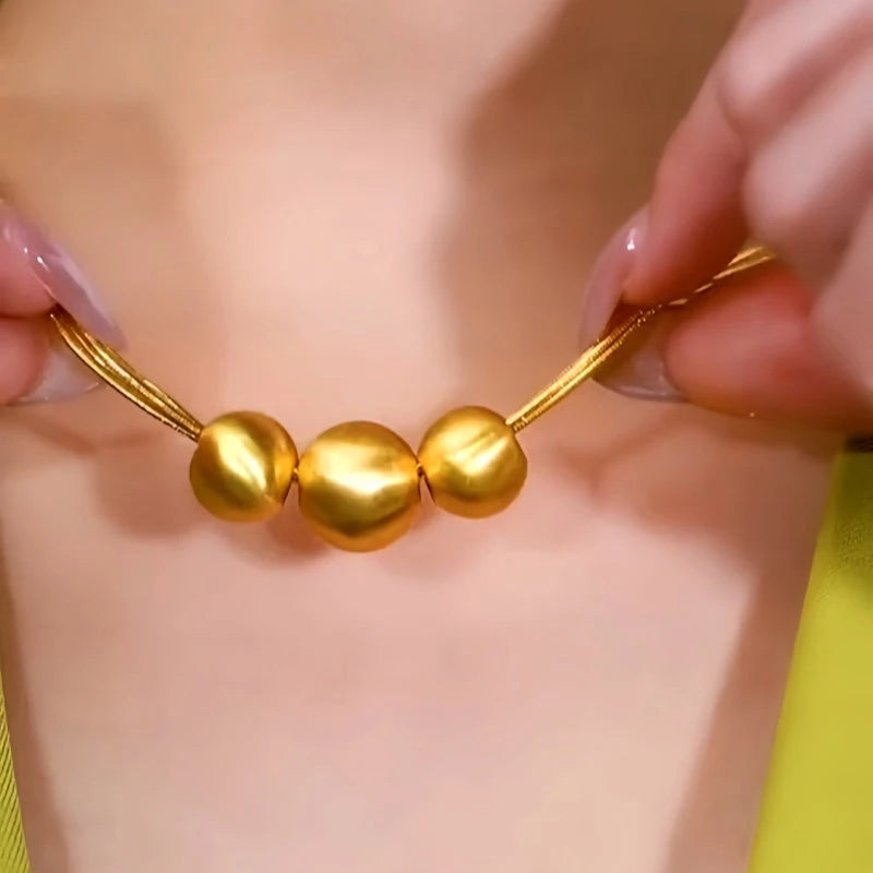 14K Gold-Plated Brushed Happy Family Three Ball Necklace worn to showcase its length and pendant detail