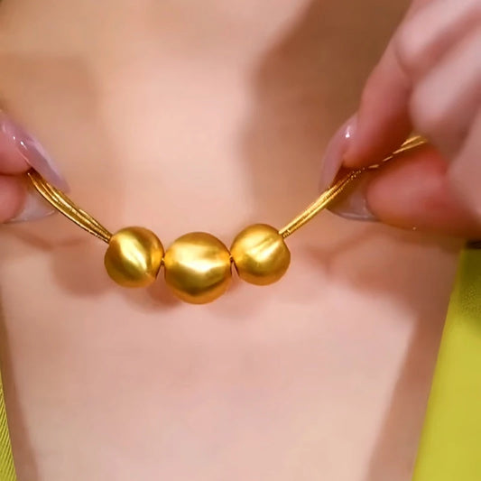 14K Gold-Plated Brushed Happy Family Three Ball Necklace worn to showcase its length and pendant detail