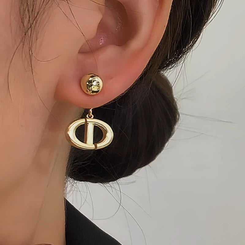 Close-up detail of the sparkling zircons and plating on the Letter Earrings