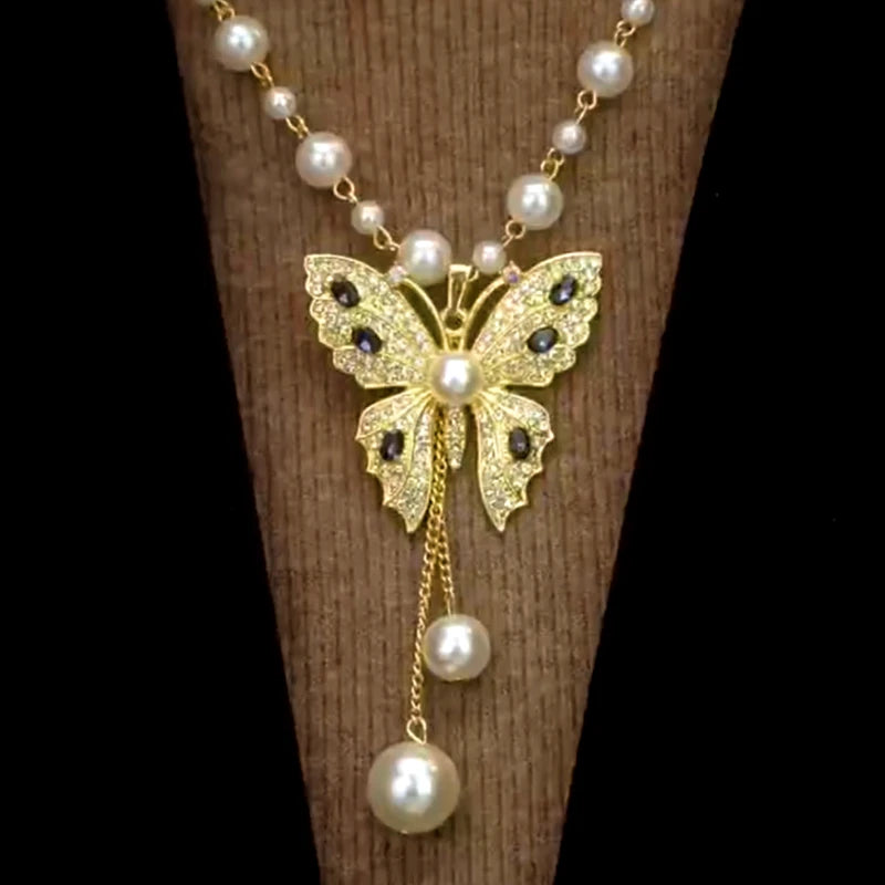 Close-up of the pendant and clasp on the Butterfly Pearl Necklace