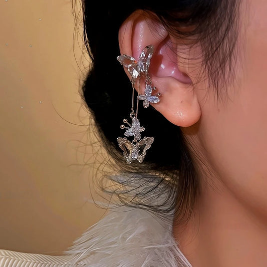 Model showcasing the dangle and style of the 14K Gold-Plated Butterfly Tassel Ear Cuffs