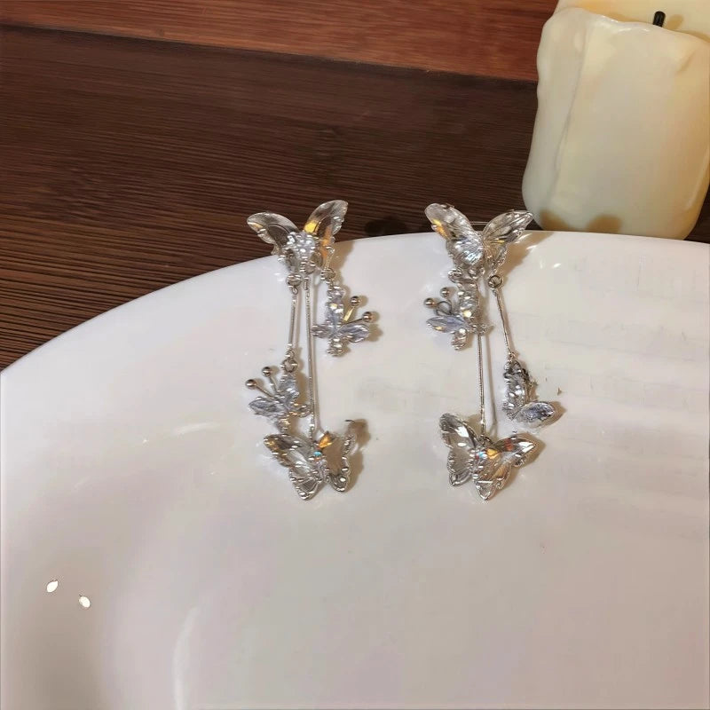 Angled view of the 14K Gold-Plated Butterfly Tassel Ear Cuffs