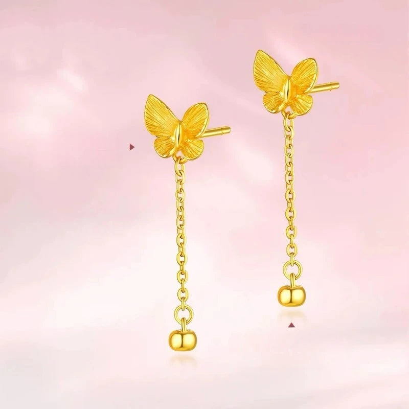 Angled view of the 14K Gold-Plated Butterfly Tassel Earrings