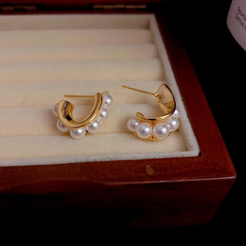 Close-up detail of the sparkling zircons and plating on the C-Shaped Pearl Earrings