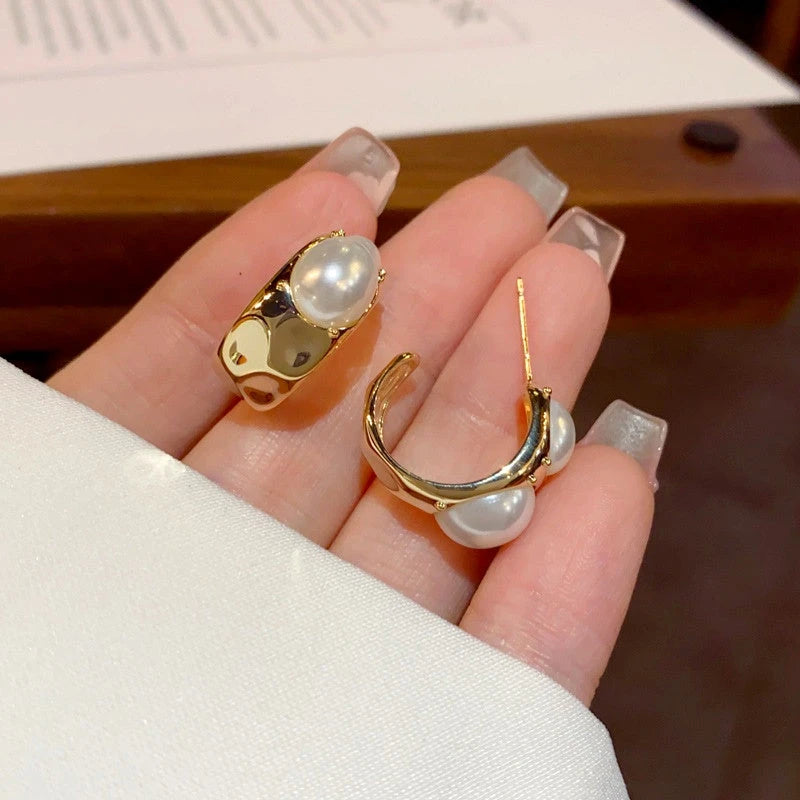 Angled view of the 14K Gold-Plated C-Shaped Pearl Earrings