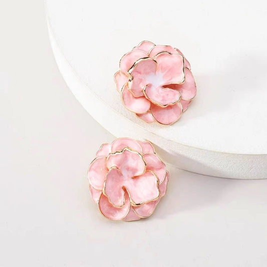 Model showcasing the dangle and style of the 14K Gold-Plated Camellia Flower Stud Earrings