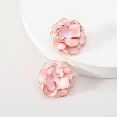 Model showcasing the dangle and style of the 14K Gold-Plated Camellia Flower Stud Earrings