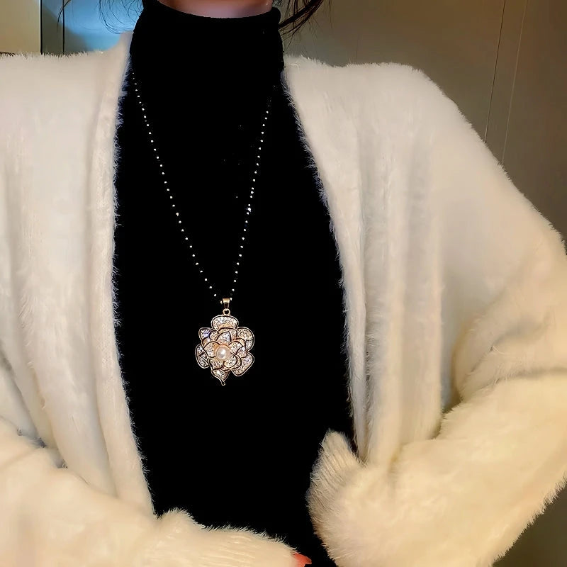 14K Gold-Plated Camellia Sweater Chain With Diamond Necklace worn to showcase its length and pendant detail