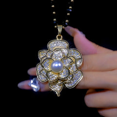 Close-up of the pendant and clasp on the Sweater Chain Necklace