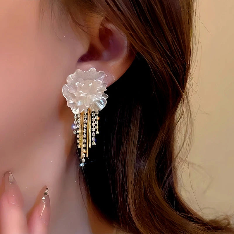 Close-up detail of the sparkling zircons and plating on the Camellia Tassel Earrings