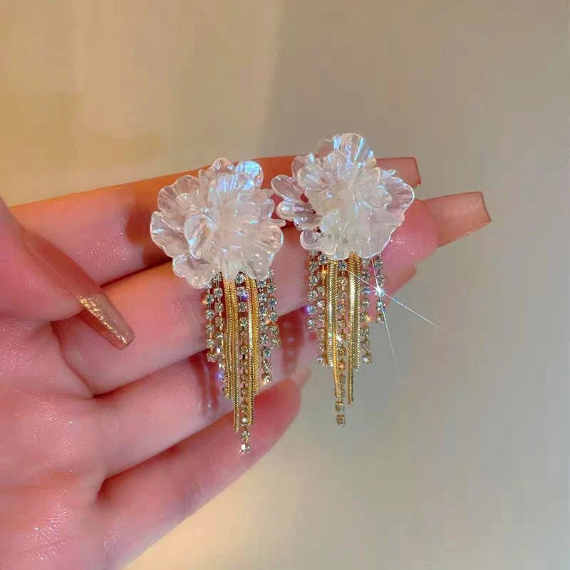 Angled view of the 14K Gold-Plated Camellia Tassel Earrings