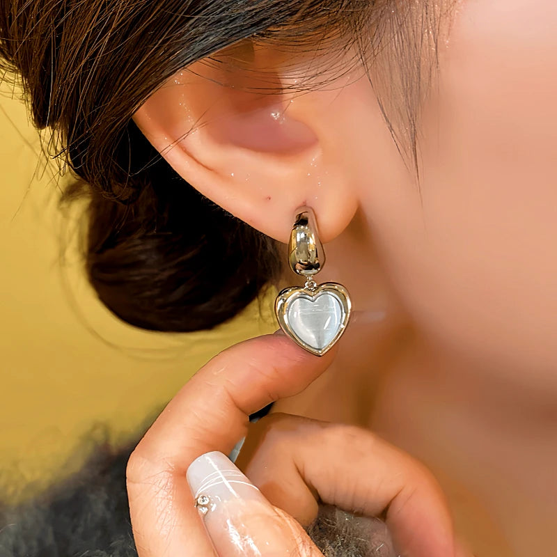 Close-up detail of the sparkling zircons and plating on the Heart Earrings