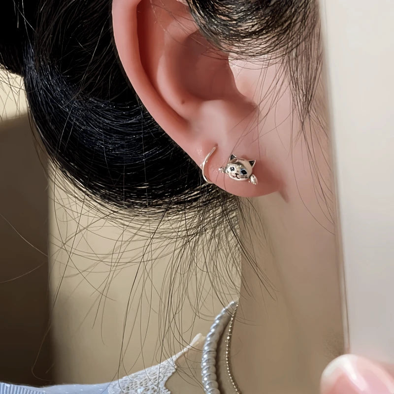 Model showcasing the dangle and style of the 14K Gold-Plated Cat's Earrings
