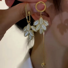 Close-up detail of the sparkling zircons and plating on the Asymmetrical Earrings