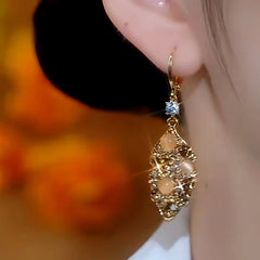 Close-up detail of the sparkling zircons and plating on the Jade Leaves Earrings