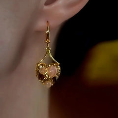 Close-up detail of the sparkling zircons and plating on the Heart Earrings