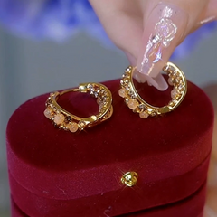 Close-up detail of the sparkling zircons and plating on the Cat's Eye Hoops